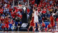 Aaron Craft #4 of the Ohio State Buckeyes shoots a game-winning three point basket against Georges Niang #31 of the Iowa State Cyclones late in the second half during the third round of the 2013 NCAA Men's Basketball Tournament at UD Arena on March 24, 20