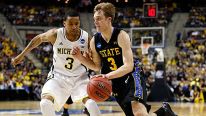 Nate Wolters #3 of the South Dakota State Jackrabbits drives in the second half against Trey Burke #3 of the Michigan Wolverines during the second round of the 2013 NCAA Men's Basketball Tournament at at The Palace of Auburn Hills on March 21, 2013 in Aub