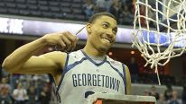Georgetown forward Otto Porter Jr. (22) is all smiles as he goes in to cut the net after their 61-39 win over Syracuse to capture the Big East regular season title on March 9, 2013 in Washington, DC