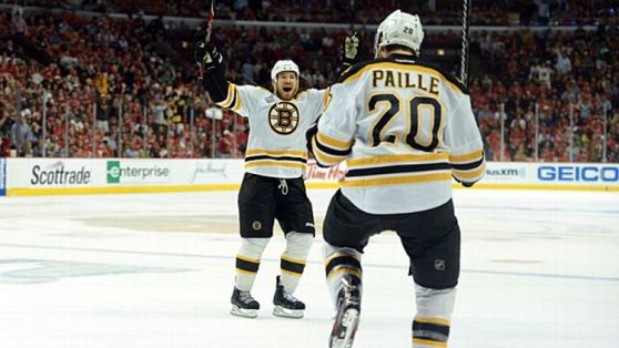 Daniel Paille #20 and Andrew Ference #21 of the Boston Bruins
