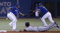 Brian Dozier #2 of the Minnesota Twins steals second base in the first inning and will advance to third bas eon the throwing error by J.P. Arencibia #9 of the Toronto Blue Jays as Jose Reyes #7 cannot handle the throw during MLB game action on July 7, 201