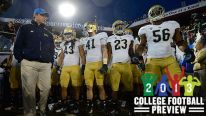 Head Coach Jim Mora (L) of the UCLA Bruins stands with his team before they take the field to play the Stanford Cardinals in the Pac-12 Championship Game at Stanford Stadium on November 30, 2012 in Stanford, California.