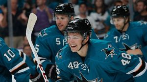 Tomas Hertl #48, Jason Demers #5 and Brad Stuart #7 of the San Jose Sharks 