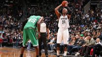 Paul Pierce #34 of the Brooklyn Nets passes the ball against the Boston Celtics during a preseason game at the Barclays Center on October 15, 2013 in the Brooklyn borough of New York City. 