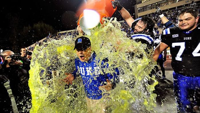 Duke and David Cutcliffe celebrate after beating Miami