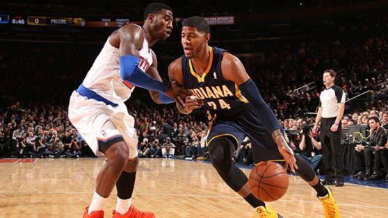 Paul George #24 of the Indiana Pacers drives against Iman Shumpert #21 of the New York Knicks during a game at Madison Square Garden in New York City on November 20, 2013.