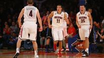 Kaleb Tarczewski #35 of the Arizona Wildcats celebrates a dunk with Aaron Gordon #11, and T.J. McConnell #4 during their championship game of the NIT Season Tip Off against Duke Blue Devils at Madison Square Garden on November 29, 2013 in New York City.