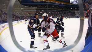  Jay Bouwmeester #19 of the St. Louis Blues keeps Brandon Dubinsky #17 of the Columbus Blue Jackets