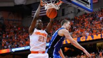 Tyler Roberson #21 of the Syracuse Orange dunks the ball against Marshall Plumlee #40 of the Duke Blue Devils during the first half at the Carrier Dome on February 1, 2014 in Syracuse, New York.