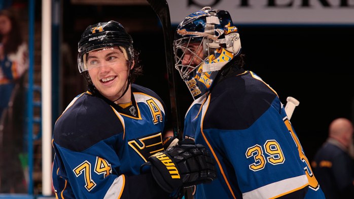 T.J. Oshie #74 of the St. Louis Blues celebrates with goalie Ryan Miller